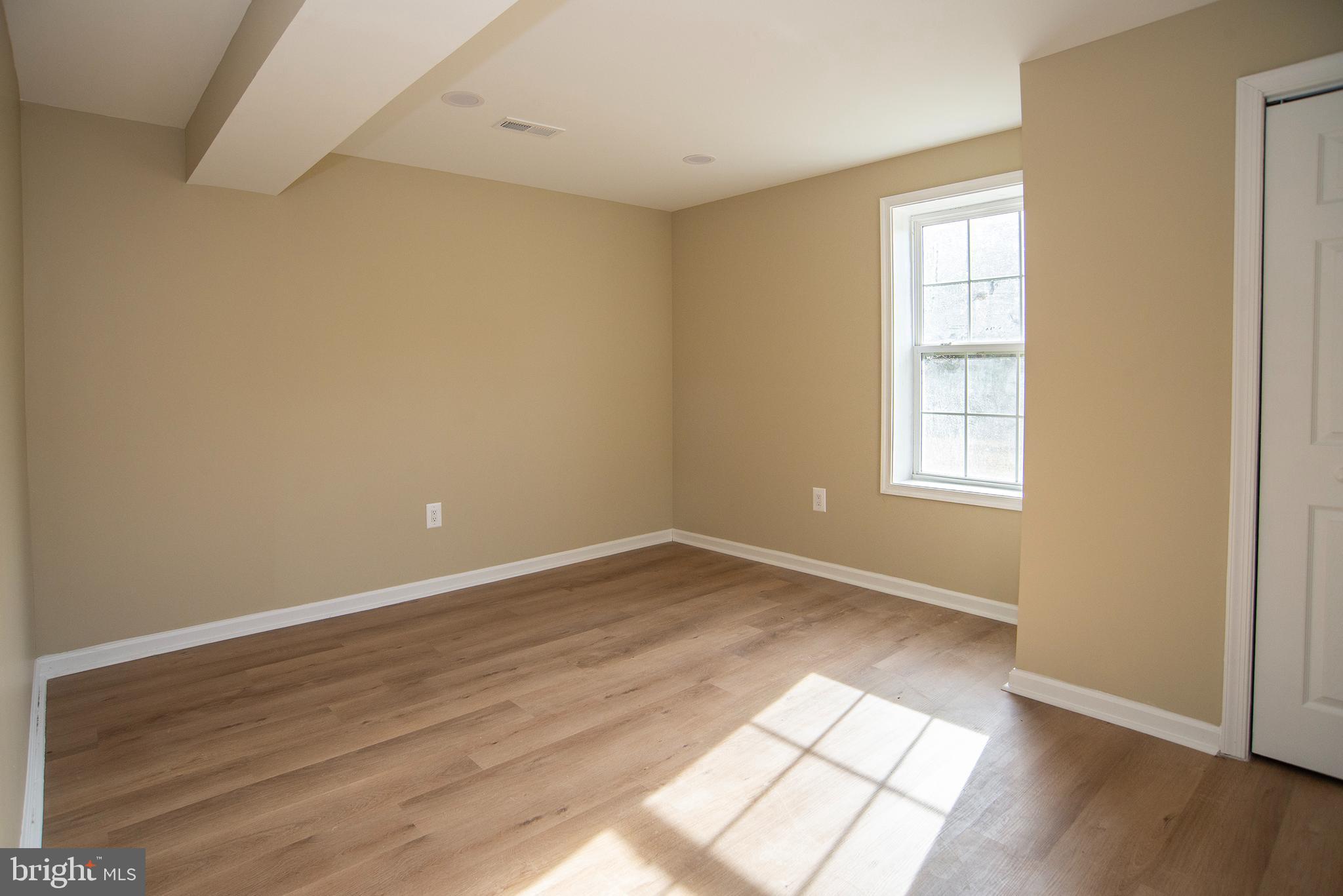 20 Aster Lane Stafford, VA 22554 - Photo 44 of 57 an empty room with wooden floor and windows