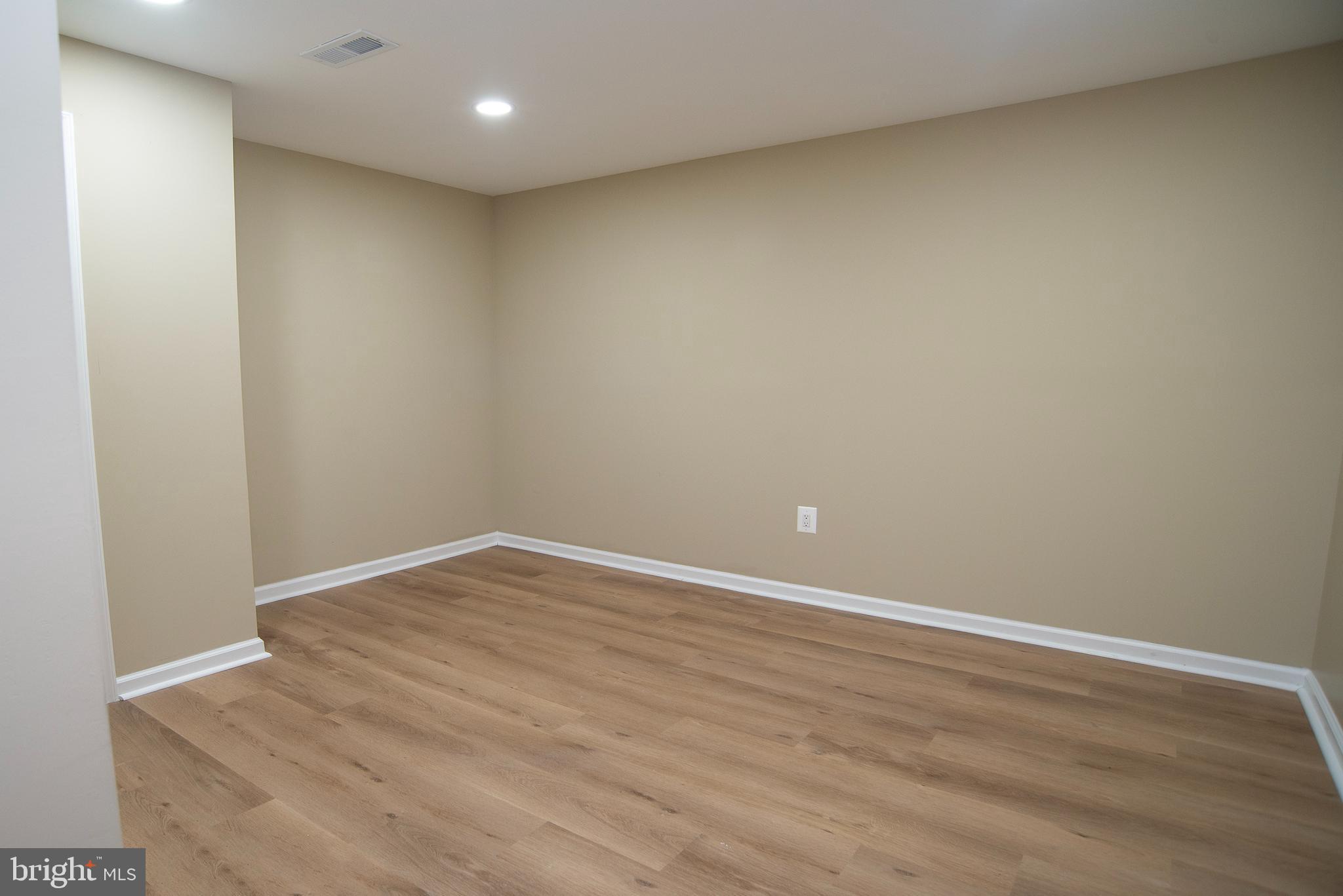20 Aster Lane Stafford, VA 22554 - Photo 49 of 57 a view of an empty room with wooden floor