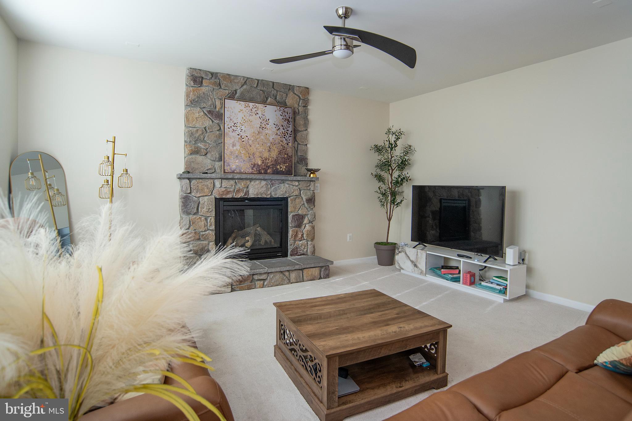 20 Aster Lane Stafford, VA 22554 - Photo 7 of 57 a bedroom with furniture and a fireplace