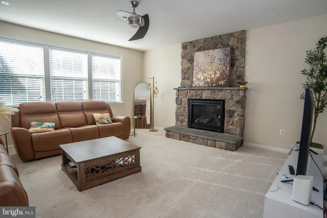 a kitchen with stainless steel appliances granite countertop a refrigerator stove and oven