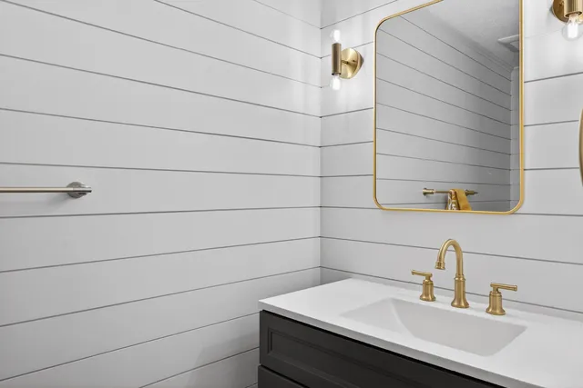 a bathroom with a sink and shower