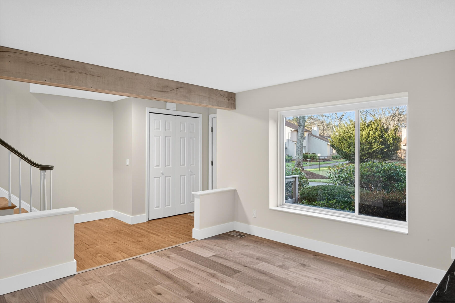 481 Buck Island Road, Unit 11BB West Yarmouth, MA 02673 - Photo 2 of 34 a view of an empty room with wooden floor and a window