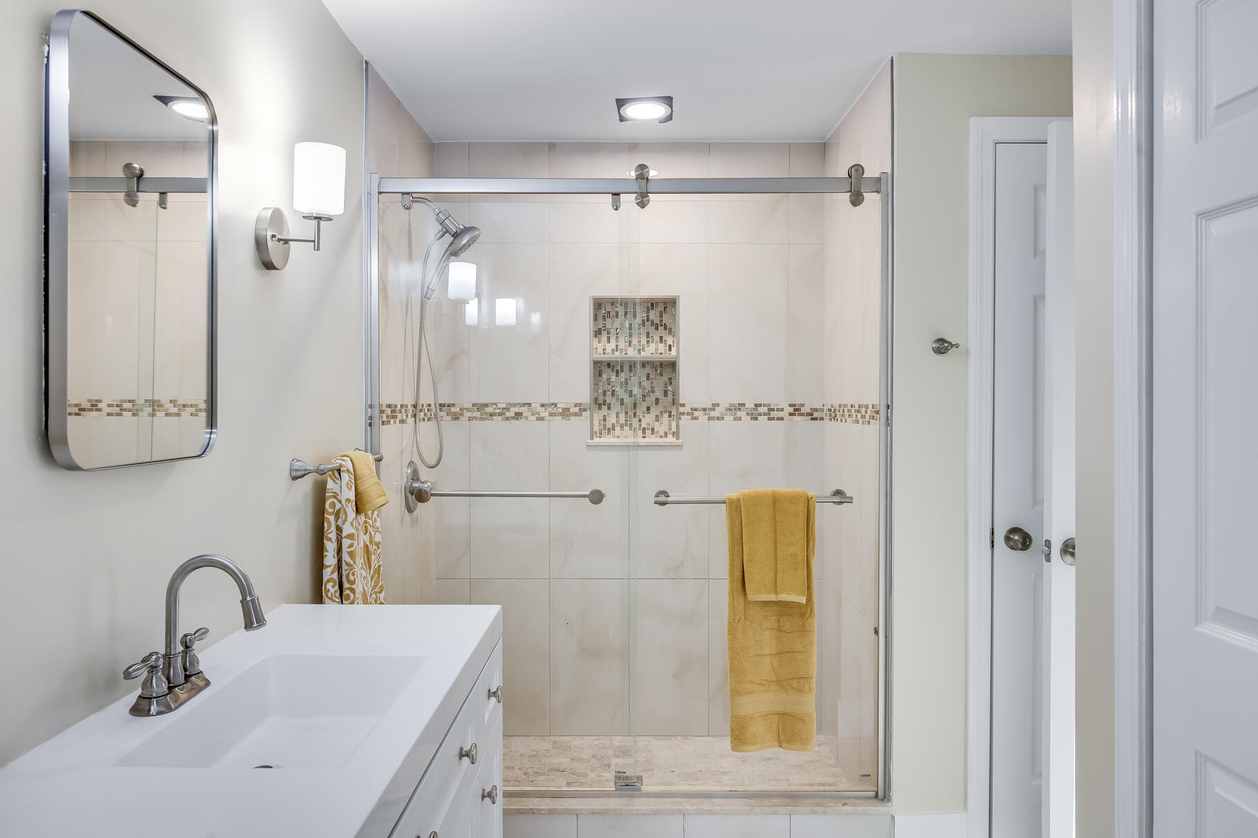 481 Buck Island Road, Unit 11BB West Yarmouth, MA 02673 - Photo 22 of 34 a bathroom with a sink mirror and shower