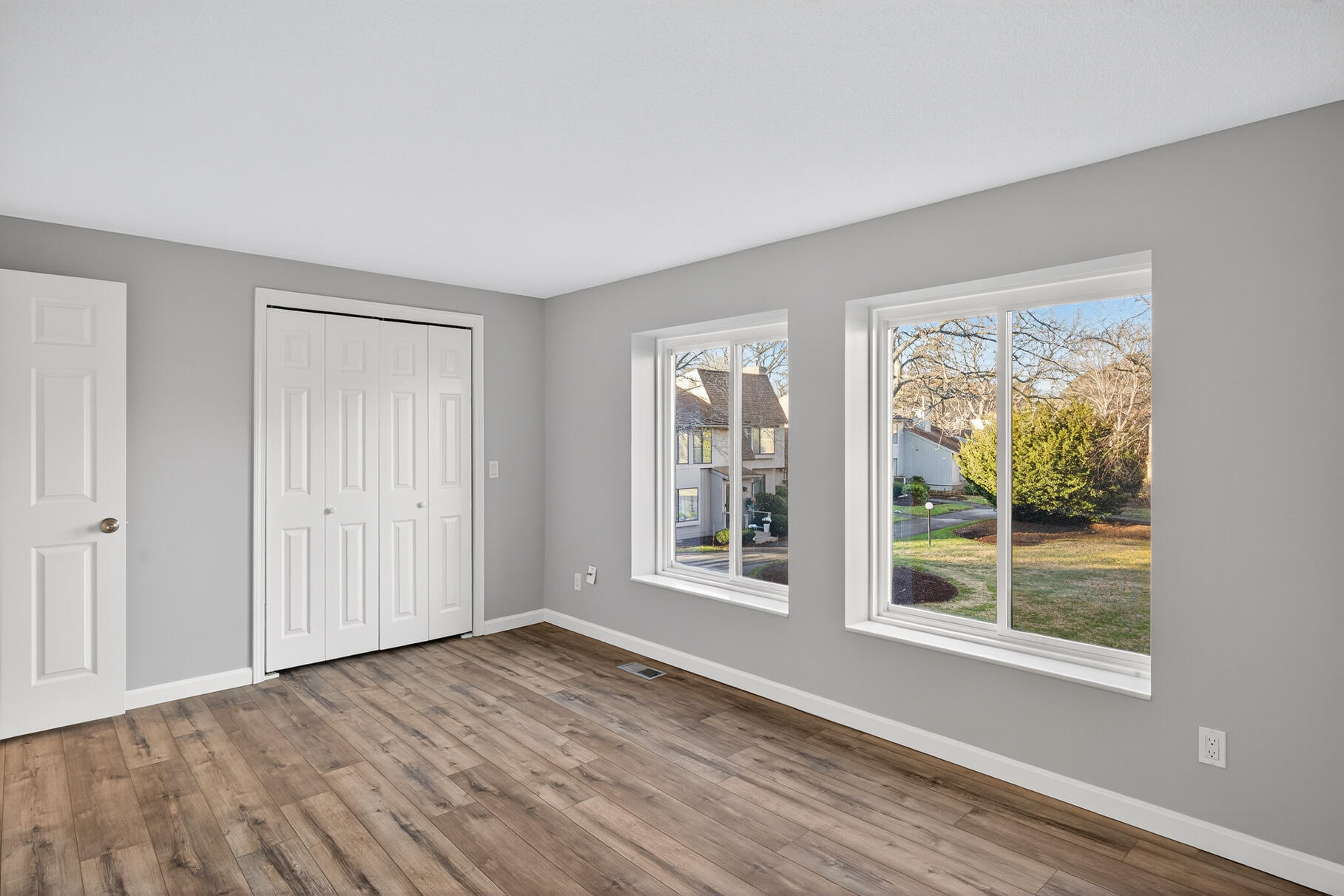 481 Buck Island Road, Unit 11BB West Yarmouth, MA 02673 - Photo 24 of 34 a view of an empty room with wooden floor and a window