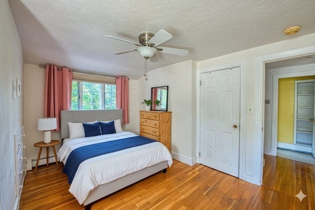 137 Pond Street Sharon, MA 02067 - Photo 13 of 23 a bedroom with a bed and wooden floor