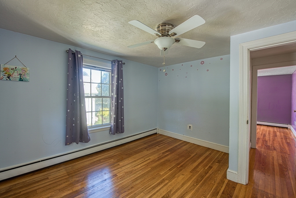 137 Pond Street Sharon, MA 02067 - Photo 15 of 23 an empty room with wooden floor fan and windows