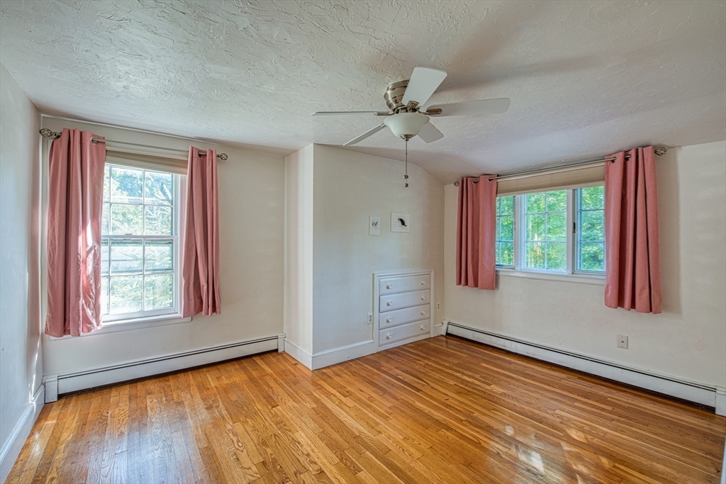 137 Pond Street Sharon, MA 02067 - Photo 17 of 23 a view of empty room with wooden floor and fan