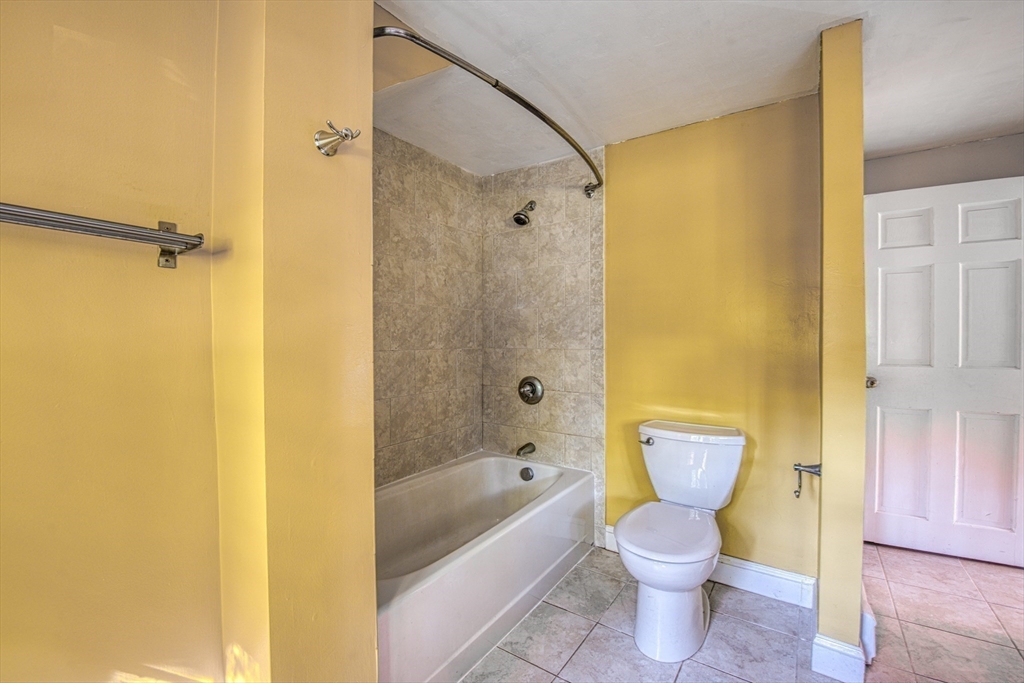 137 Pond Street Sharon, MA 02067 - Photo 19 of 23 a bathroom with a bathtub shower and toilet