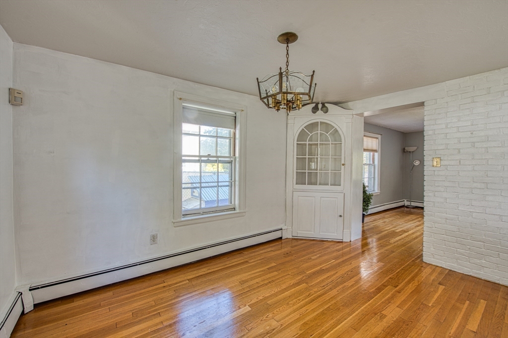 137 Pond Street Sharon, MA 02067 - Photo 6 of 23 a view of empty room with wooden floor and fan