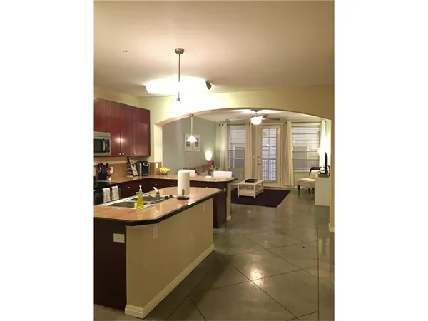 a kitchen with a sink cabinets and counter