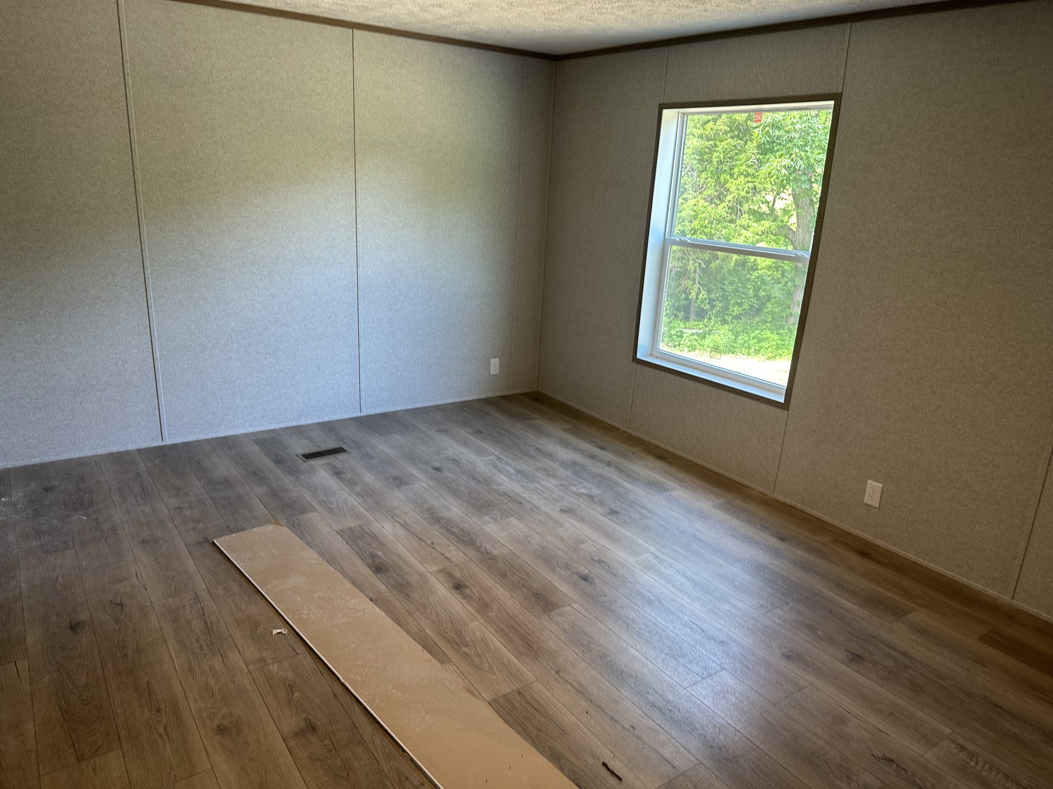 406 Shiloh Church Road Woodbury, TN 37190 - Photo 15 of 18 an empty room with wooden floor and windows