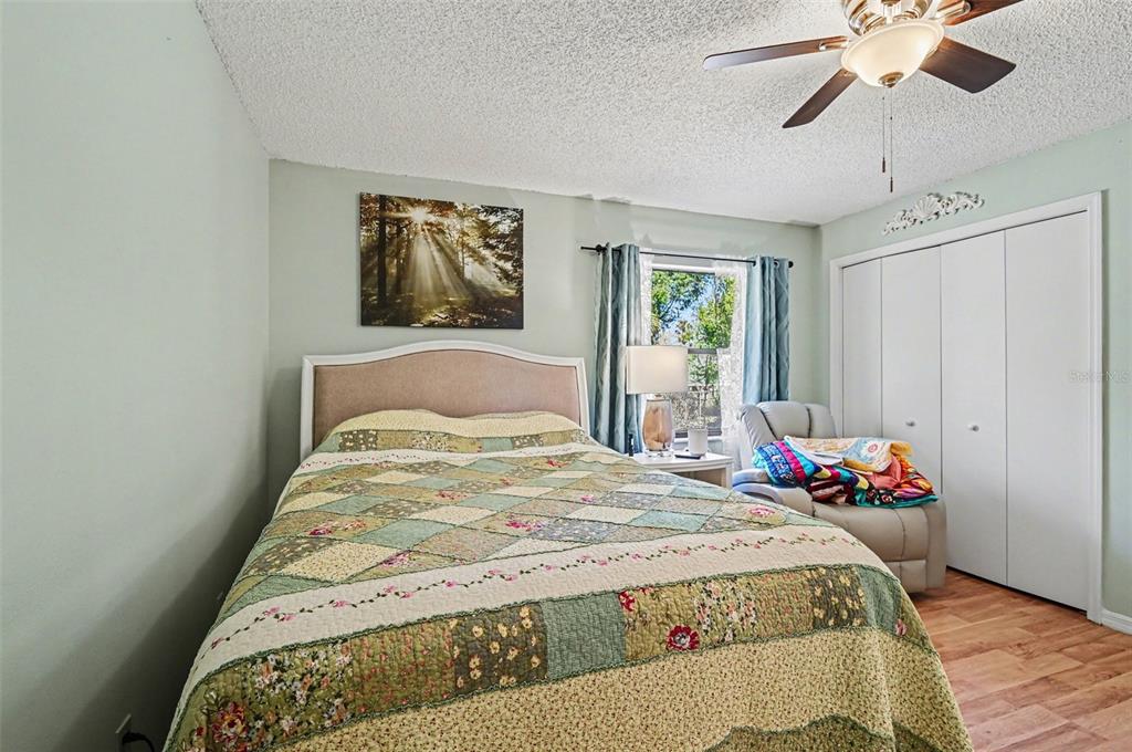 12435 Orangewood Circle Tavares, FL 32778 - Photo 19 of 30 a bedroom with bed and window