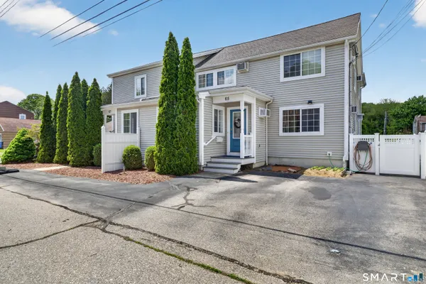 a view of a house with outdoor space and a yard