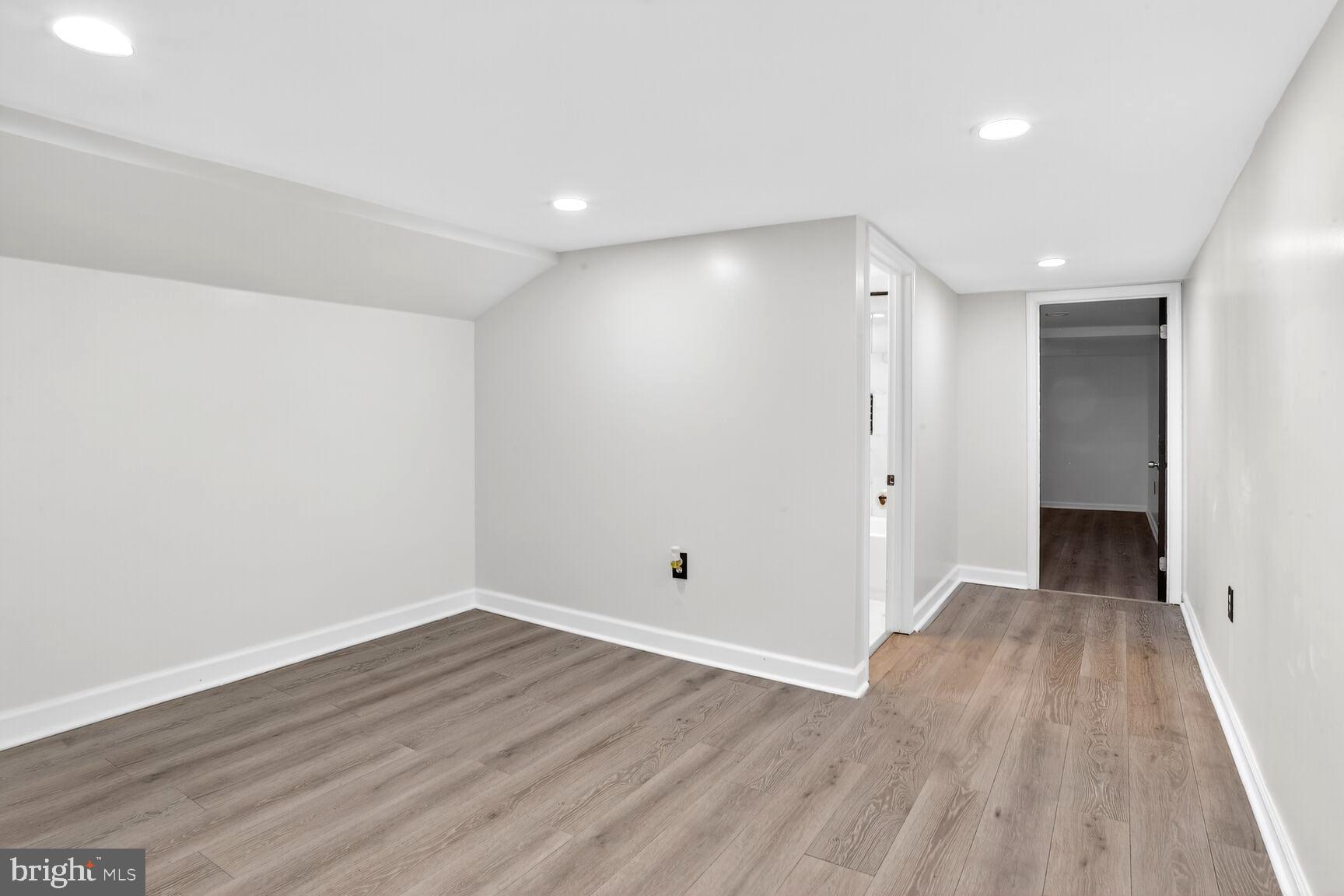 3808 6th Street Baltimore, MD 21225 - Photo 17 of 21 a view of an empty room with wooden floor