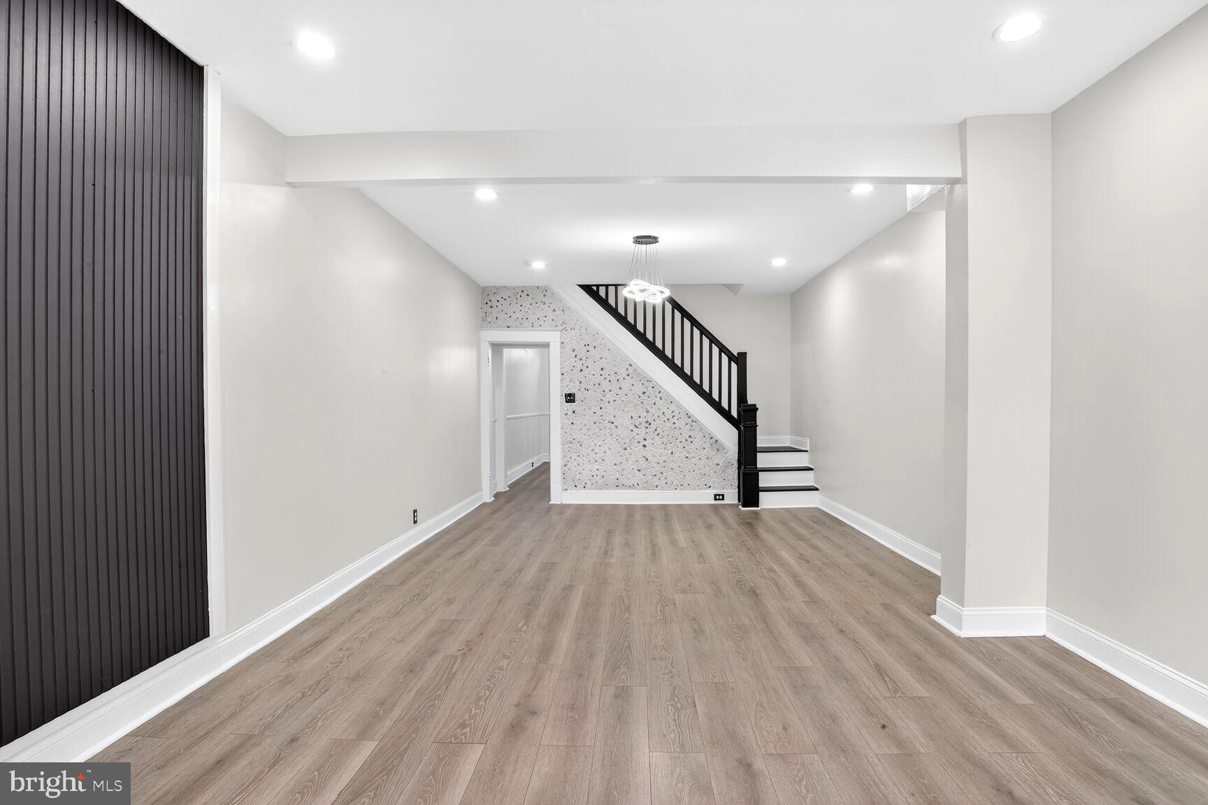 3808 6th Street Baltimore, MD 21225 - Photo 3 of 21 a view of an empty room with wooden floor