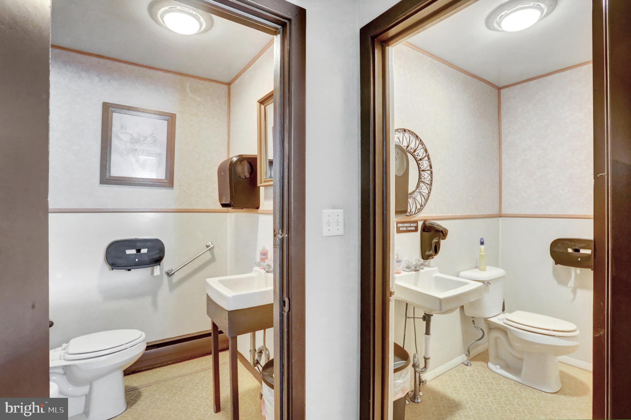 8370 Rte 104 Mount Pleasant Mills, PA 17853 - Photo 20 of 71 a white toilet sitting next to a bathroom sink and a mirror