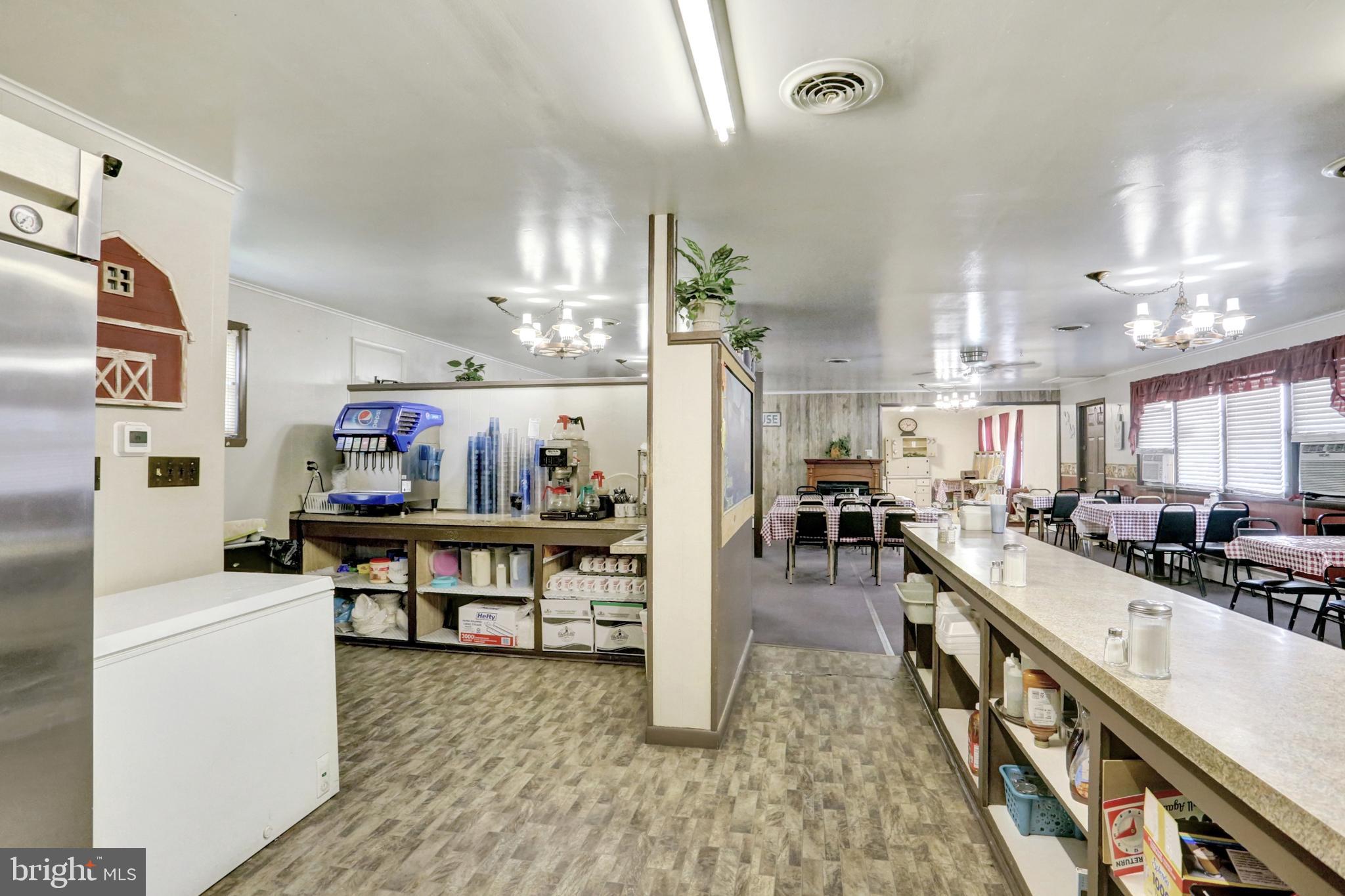8370 Rte 104 Mount Pleasant Mills, PA 17853 - Photo 25 of 71 a kitchen with stainless steel appliances granite countertop sink stove top oven and cabinets