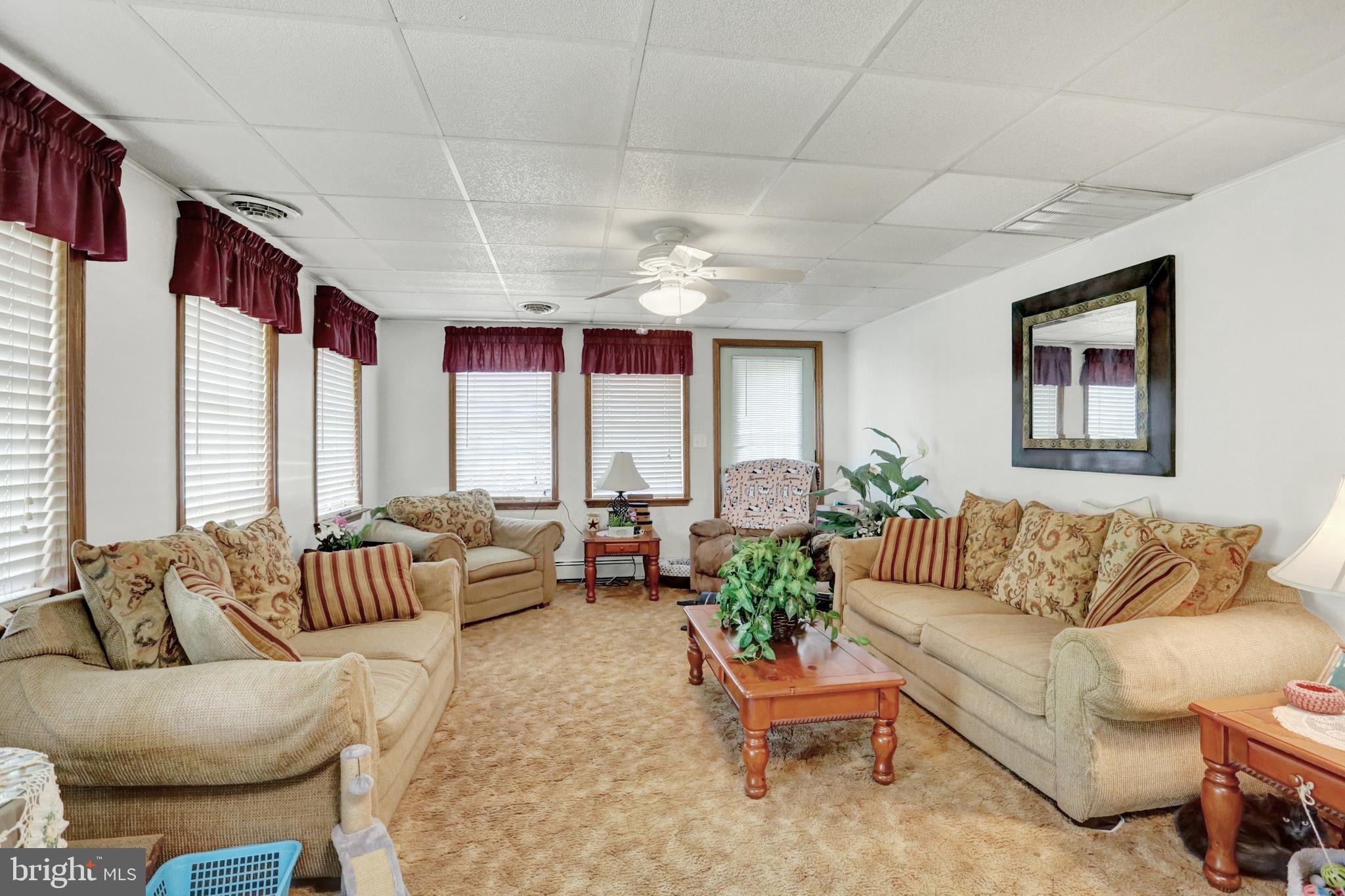 8370 Rte 104 Mount Pleasant Mills, PA 17853 - Photo 38 of 71 a living room with furniture and a large window