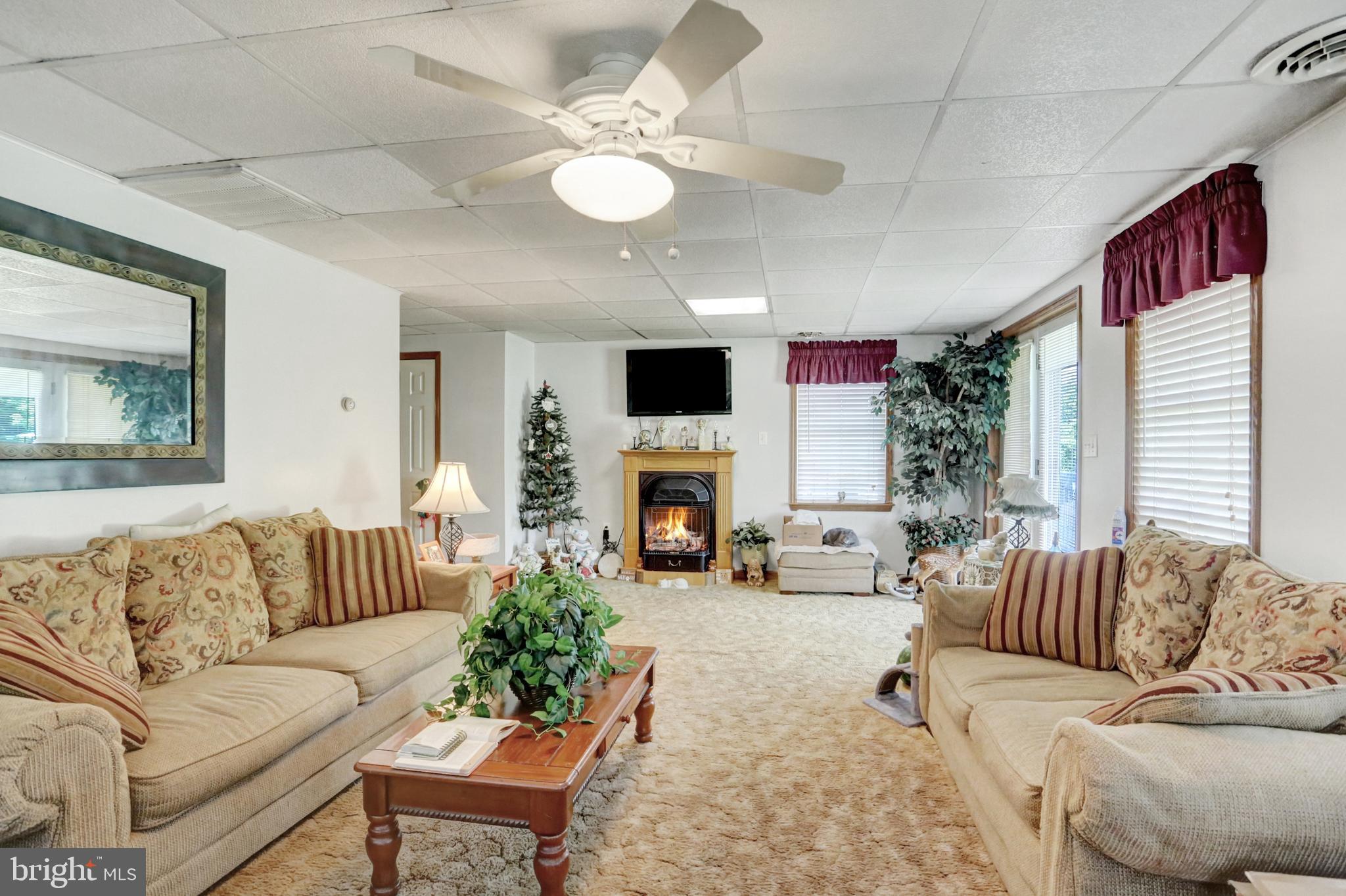 8370 Rte 104 Mount Pleasant Mills, PA 17853 - Photo 39 of 71 a living room with furniture fireplace and a large window