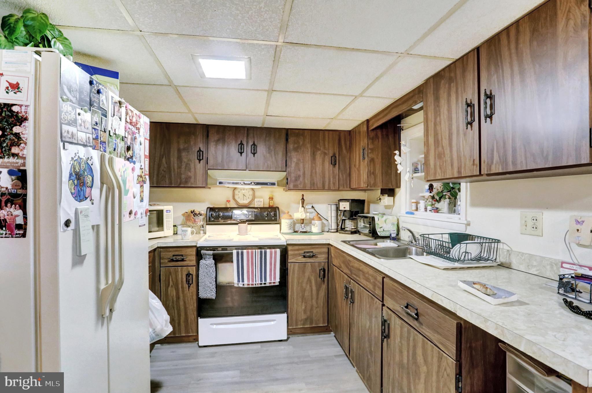 8370 Rte 104 Mount Pleasant Mills, PA 17853 - Photo 41 of 71 a kitchen with stainless steel appliances granite countertop a sink stove refrigerator and cabinets