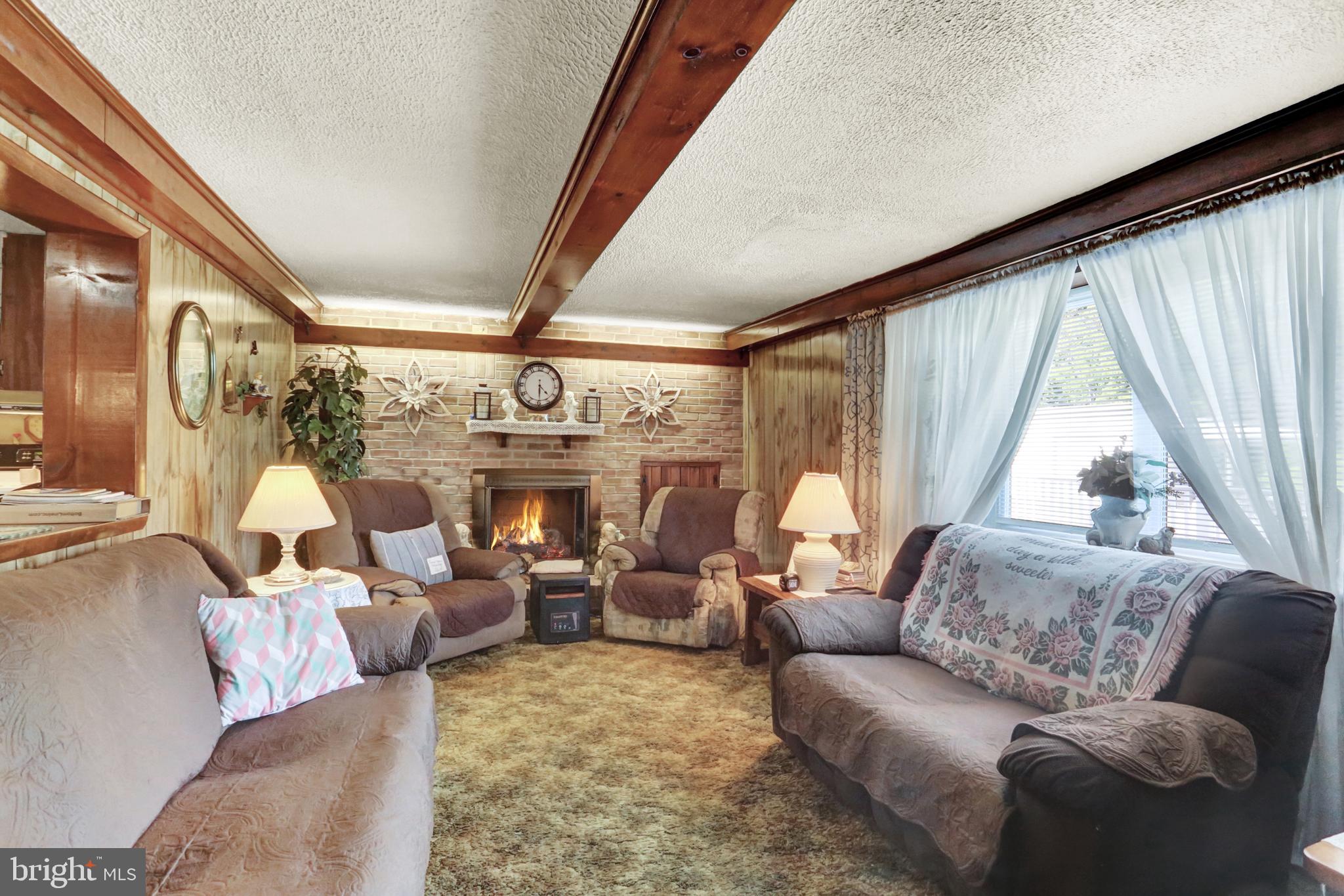 8370 Rte 104 Mount Pleasant Mills, PA 17853 - Photo 43 of 71 a living room with furniture and a large window