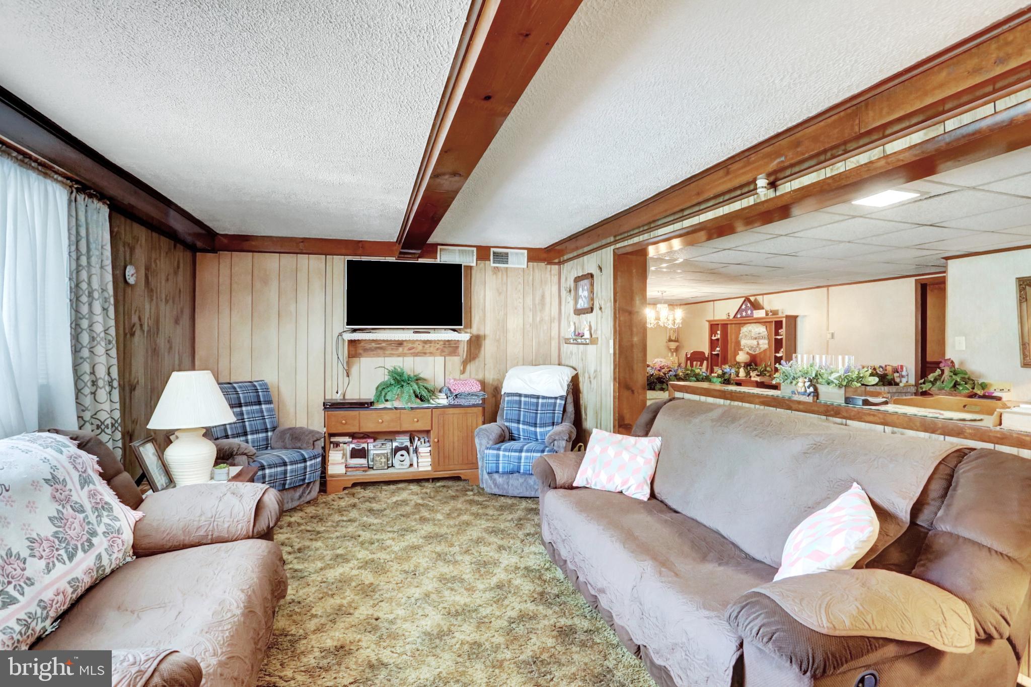 8370 Rte 104 Mount Pleasant Mills, PA 17853 - Photo 44 of 71 a living room with furniture and a flat screen tv