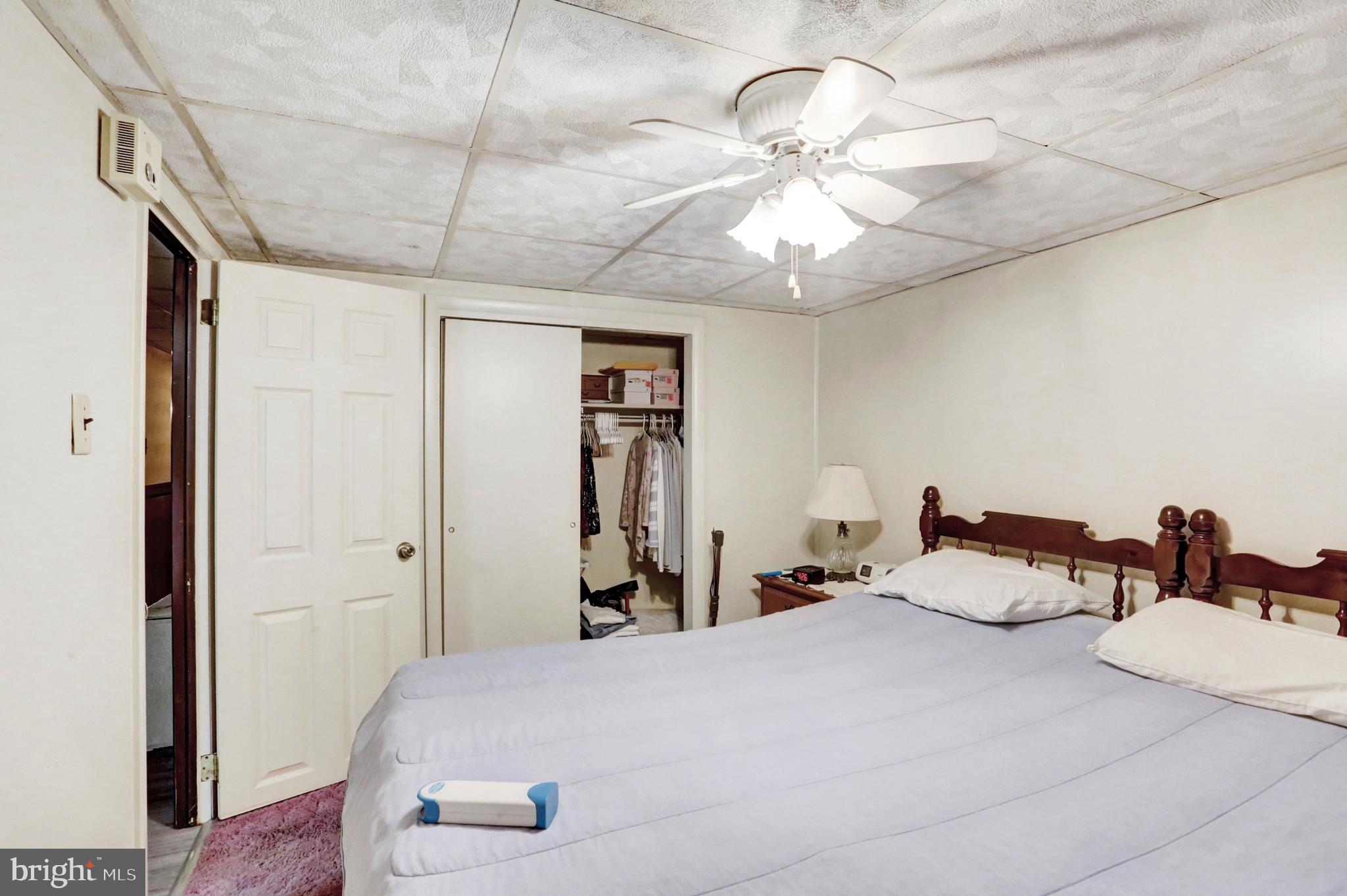 8370 Rte 104 Mount Pleasant Mills, PA 17853 - Photo 47 of 71 a bedroom with a bed and a chandelier