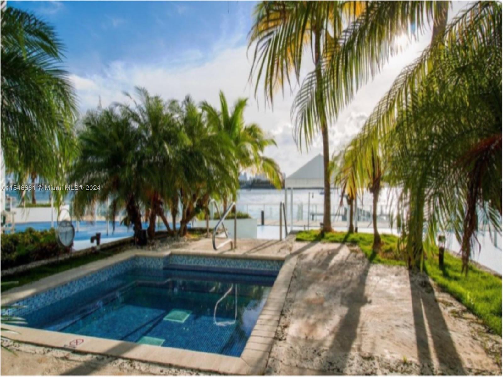 1035 West Avenue, Unit 802 Miami Beach, FL 33139 - Photo 13 of 14 a view of outdoor space with trees