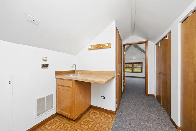 a utility room with cabinets washer and dryer