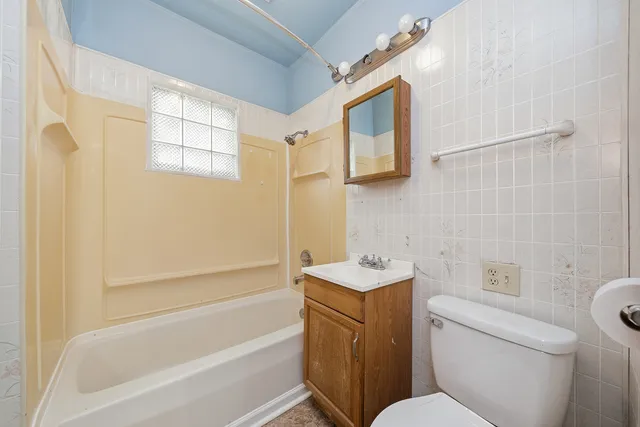 a bathroom with a toilet sink and bathtub