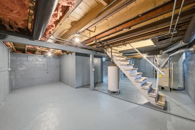 a view of an empty room with stairs