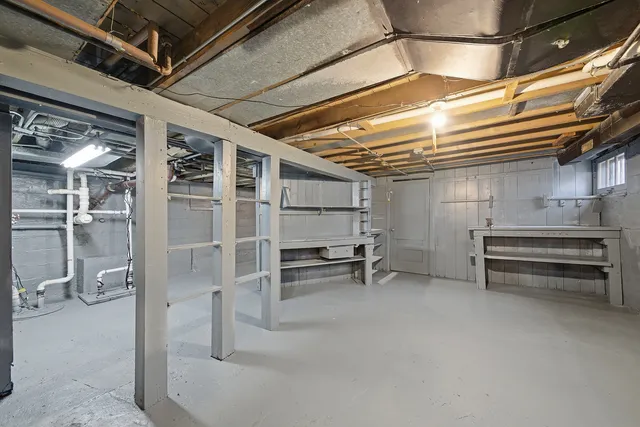 a view of an empty room with a staircase