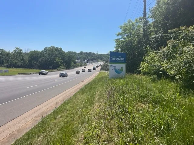 a view of a road with a yard