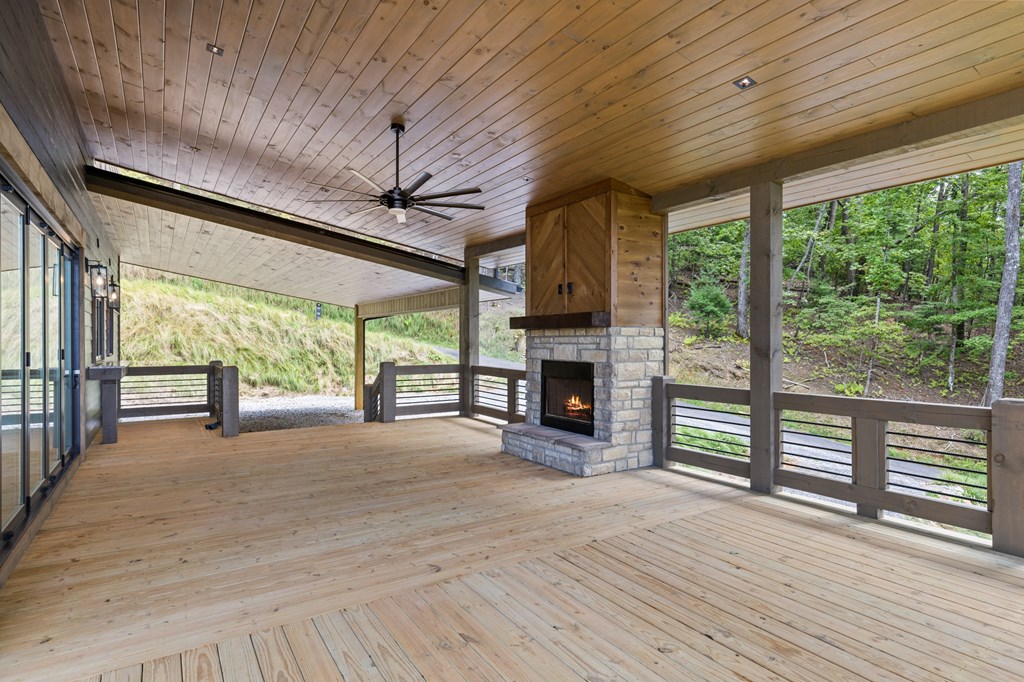 394 Mountain Trace Cherry Log, GA 30522 - Photo 12 of 70 a view of empty room with wooden floor and fireplace