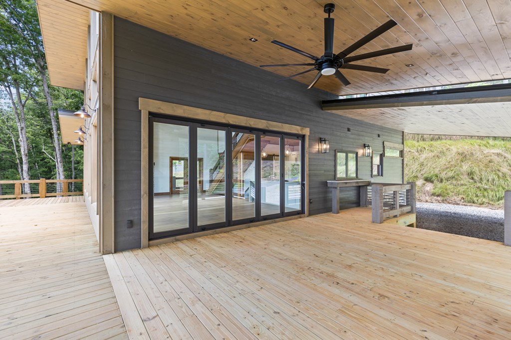 394 Mountain Trace Cherry Log, GA 30522 - Photo 13 of 70 a view of an empty room with a window and wooden floor