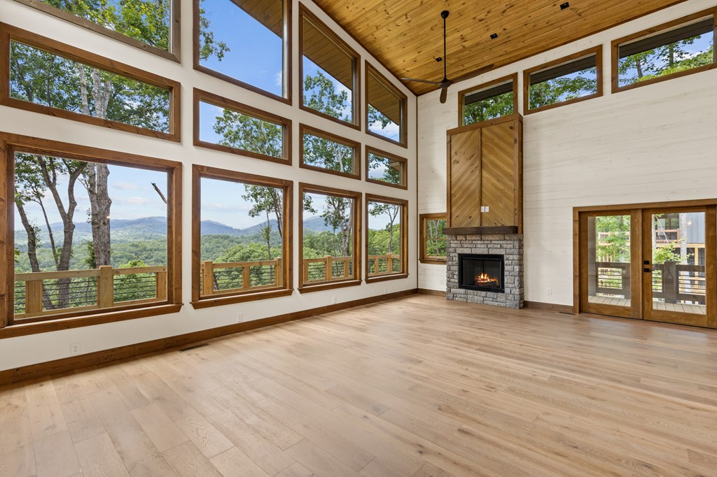 394 Mountain Trace Cherry Log, GA 30522 - Photo 15 of 70 a view of an empty room with wooden floor and a window