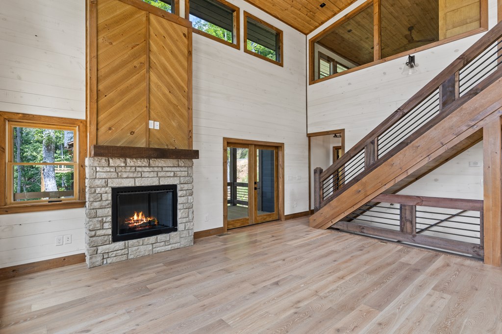 394 Mountain Trace Cherry Log, GA 30522 - Photo 17 of 70 a view of an empty room with wooden floor and a window