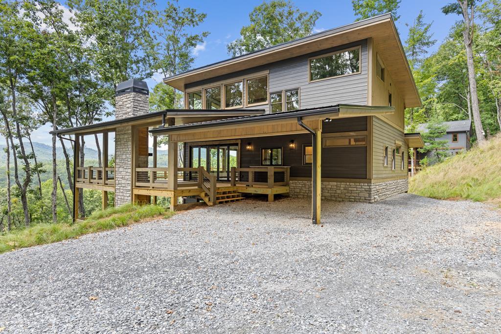 394 Mountain Trace Cherry Log, GA 30522 - Photo 2 of 70 a view of a house with wooden fence