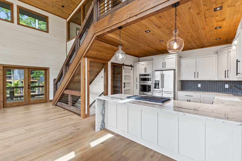 394 Mountain Trace Cherry Log, GA 30522 - Photo 24 of 70 a kitchen with stove and cabinets