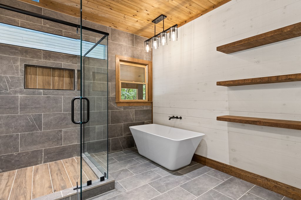 394 Mountain Trace Cherry Log, GA 30522 - Photo 32 of 70 a bathroom with a bathtub and shower