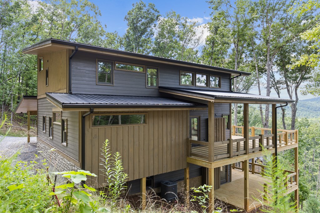 394 Mountain Trace Cherry Log, GA 30522 - Photo 4 of 70 a front view of a house with garden
