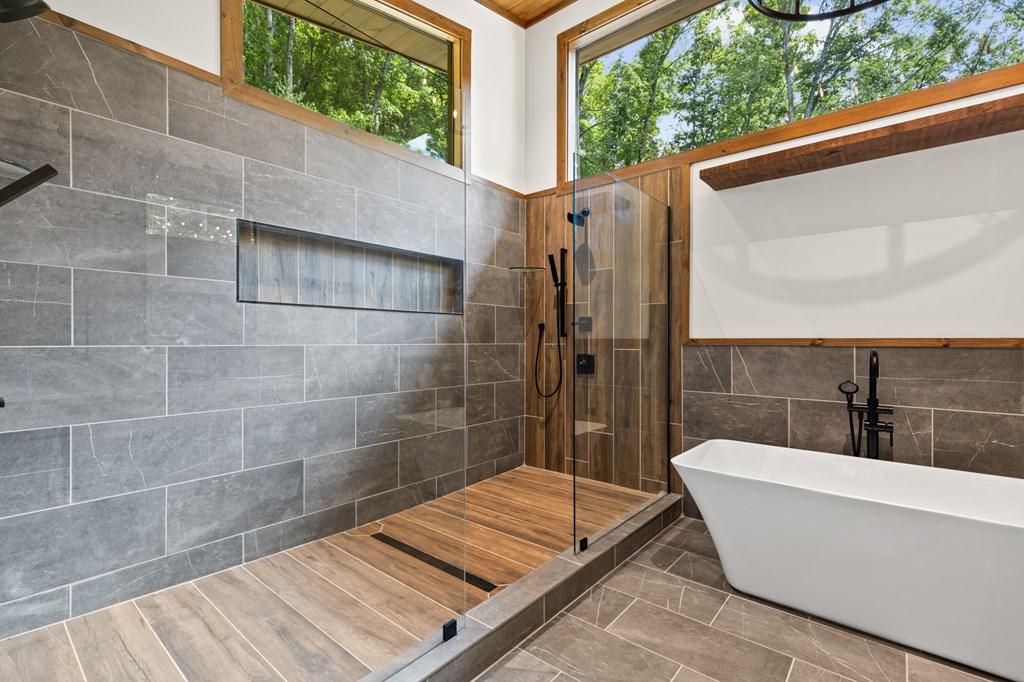 394 Mountain Trace Cherry Log, GA 30522 - Photo 42 of 70 a bathroom with a bathtub and shower