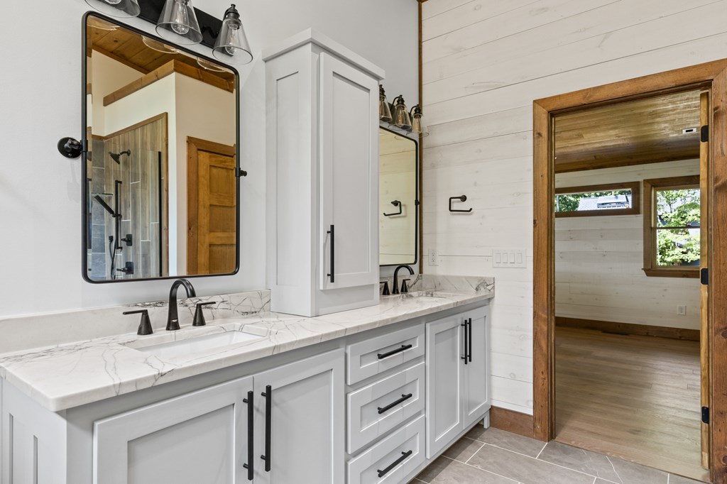 394 Mountain Trace Cherry Log, GA 30522 - Photo 45 of 70 a bathroom with a sink double vanity and a mirror