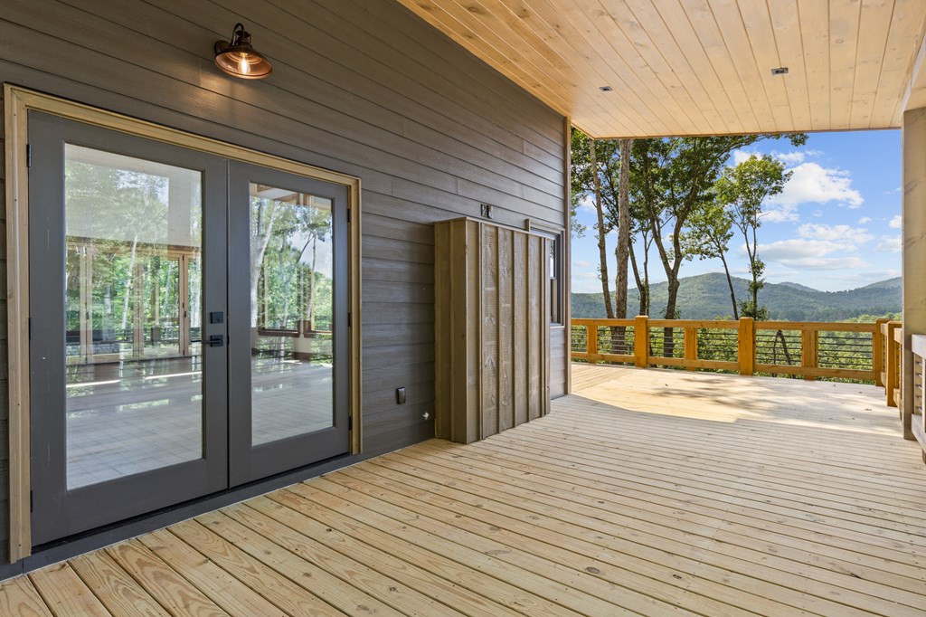 394 Mountain Trace Cherry Log, GA 30522 - Photo 47 of 70 a view of a room with wooden floor and floor to ceiling window