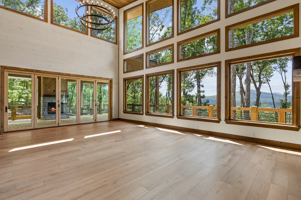 394 Mountain Trace Cherry Log, GA 30522 - Photo 48 of 70 a view of an empty room with wooden floor and a window
