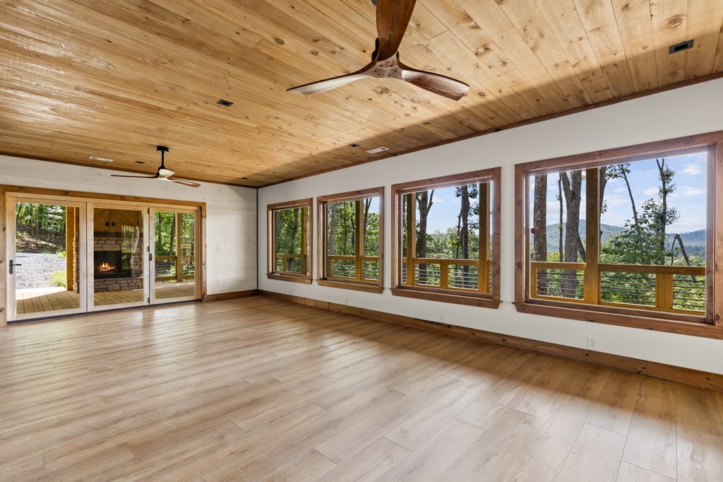 394 Mountain Trace Cherry Log, GA 30522 - Photo 49 of 70 a view of an empty room with wooden floor and a window
