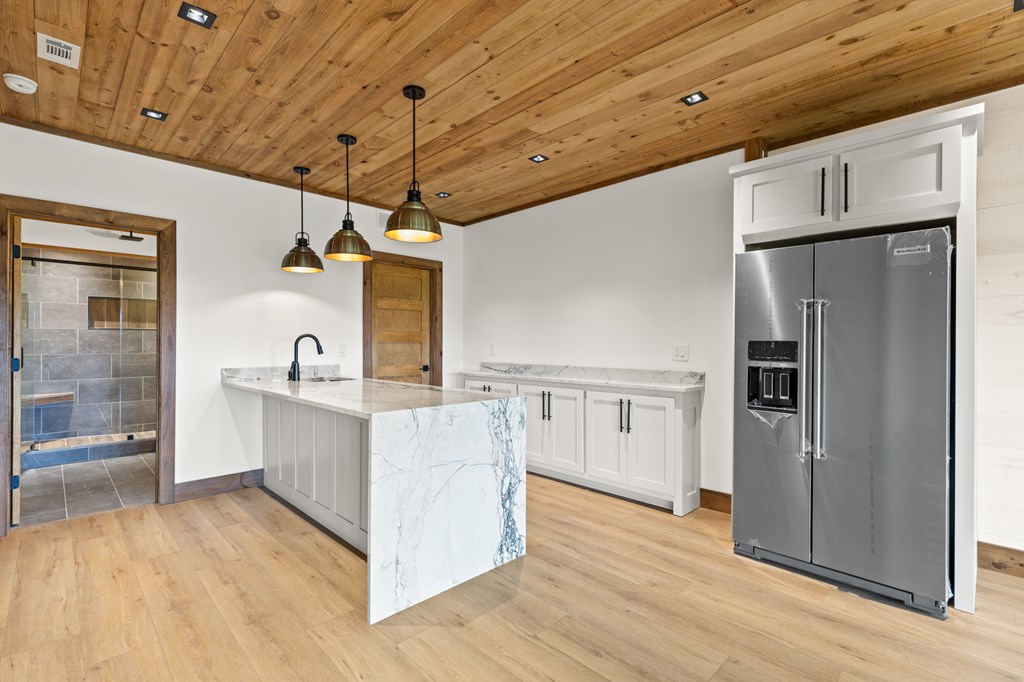 394 Mountain Trace Cherry Log, GA 30522 - Photo 50 of 70 a kitchen with stainless steel appliances a refrigerator and wooden floor