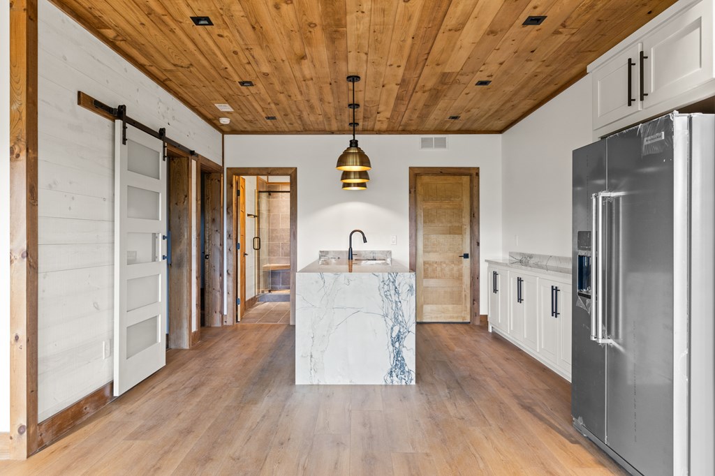 394 Mountain Trace Cherry Log, GA 30522 - Photo 52 of 70 a view of a hallway with wooden floor and staircase