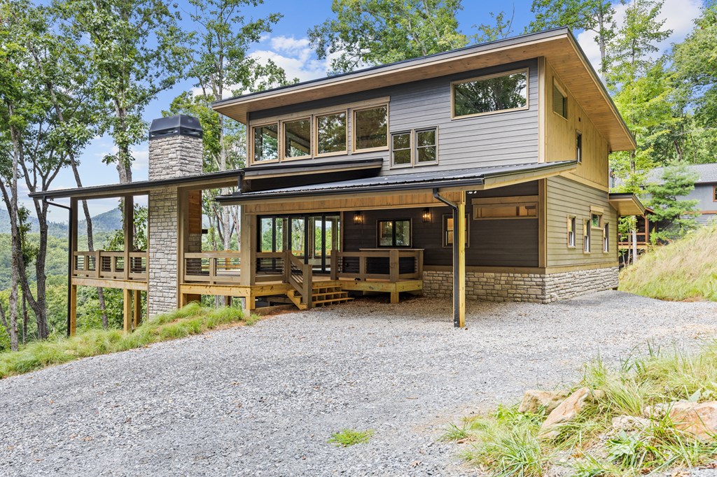 394 Mountain Trace Cherry Log, GA 30522 - Photo 6 of 70 a view of a house with a yard and sitting area
