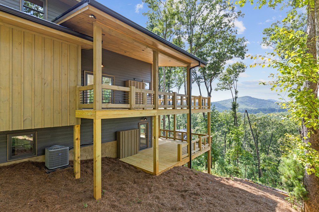 394 Mountain Trace Cherry Log, GA 30522 - Photo 64 of 70 a view of a house with backyard and sitting area